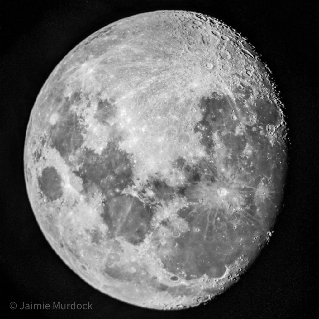 Photograph of the moon taken with a cell phone camera at the eyepiece of an 8" Dobsonian telescope.